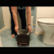 An older British woman records herself taking a shit into her bathroom trash can. She wipes her ass and prepares the trash bag for proper disposal. No product shown. About 3 minutes.